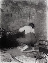 Roger Fry working on a mosaic at his home, Durbins